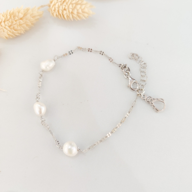 Pulsera plata y 3 perlas de...