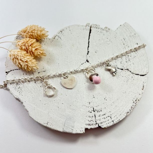 Pulsera silueta  y chupete...