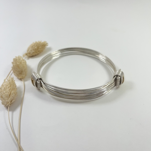 Pulsera hilos de plata con...