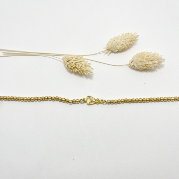 Pulsera bolitas baño oro...